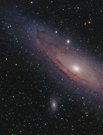 A pink cloud of dust and stars in space